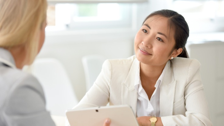 Associate looking at her opposite number