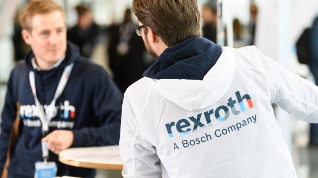 Two persons representing Bosch Rexroth at a trade show