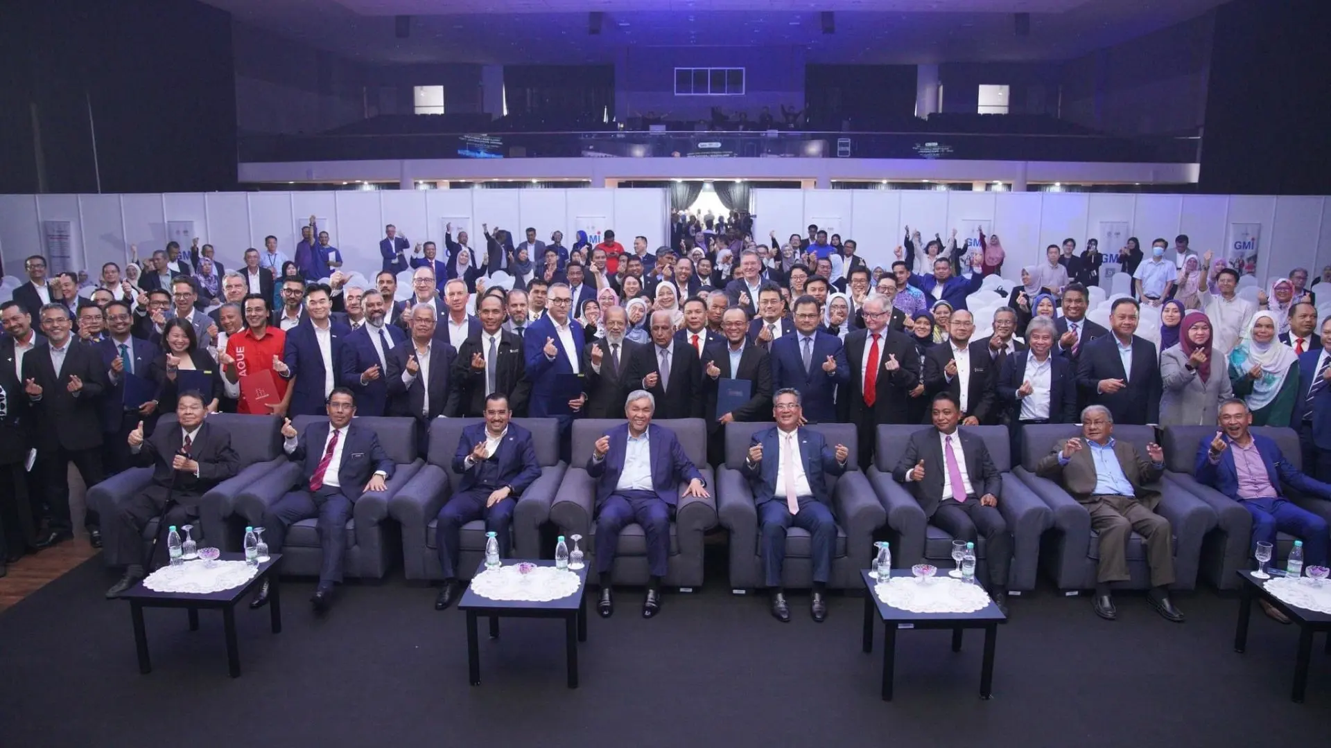 GMI MoU singing group photo