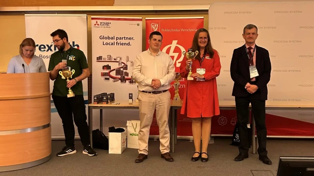 People with a trophy for partnership in the PLC Championships