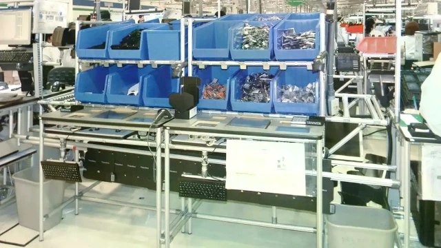 Flow racks and material shuttles
