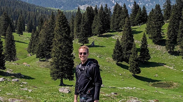 Jan Kraemer while in the Bosch Rexroth graduate program in front of hills and trees