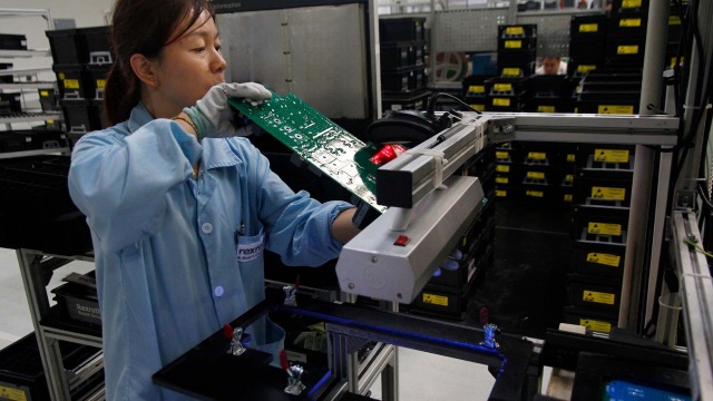 A woman working on the UV radiation process in the production facility
