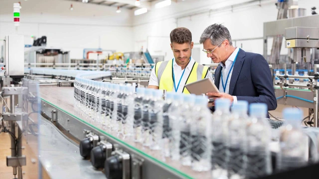 two people at production line