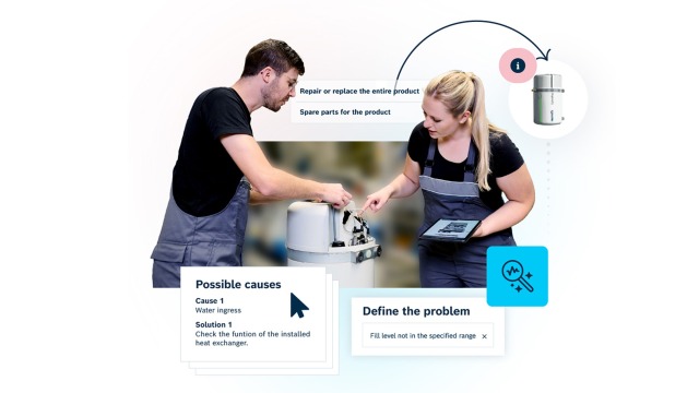Two service technicians in blue uniforms use the Hydraulic Hub web-app on a tablet to access repair instructions for a CytroPac hydraulic power unit.