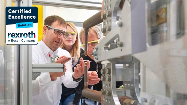 Solution partner demonstrating a new machine, specialized in electric drives, controls, linear and assembly technology, industrial hydraulics, intralogistics