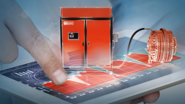 Tablet with a graph of drive data from the condition monitoring service, with a Hägglunds direct drive system placed on top.