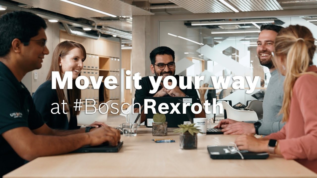 Employees laughing at work at Bosch Rexroth