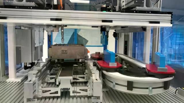 Automated production cell for battery modules with linear motors and transfer systems.
