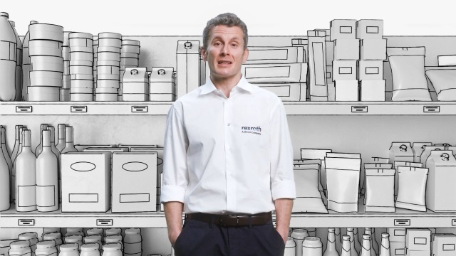 Collaborateurs de Rexroth devant l’étagère dessinée avec des produits de consommation