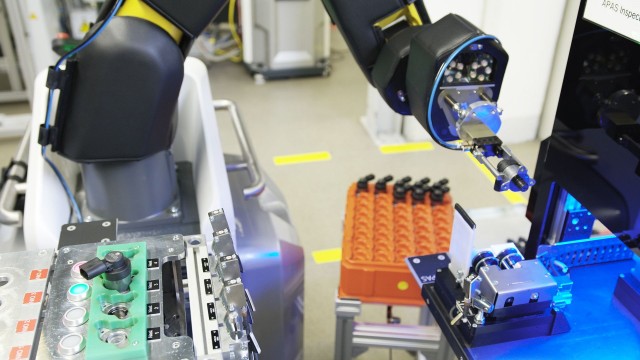 A robot carries out a visual inspection of components from an automated assembly line