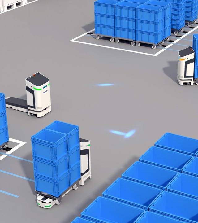 Das autonome Transportsystem ActiveShuttle transportiert Kleinladungsträger auf Bodenrollern zu einer Produktionslinie