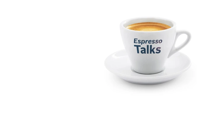 Coffee cup with the inscription "Esspresso Talks". 