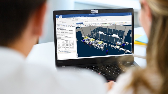 Two people in front of the MTpro planning software