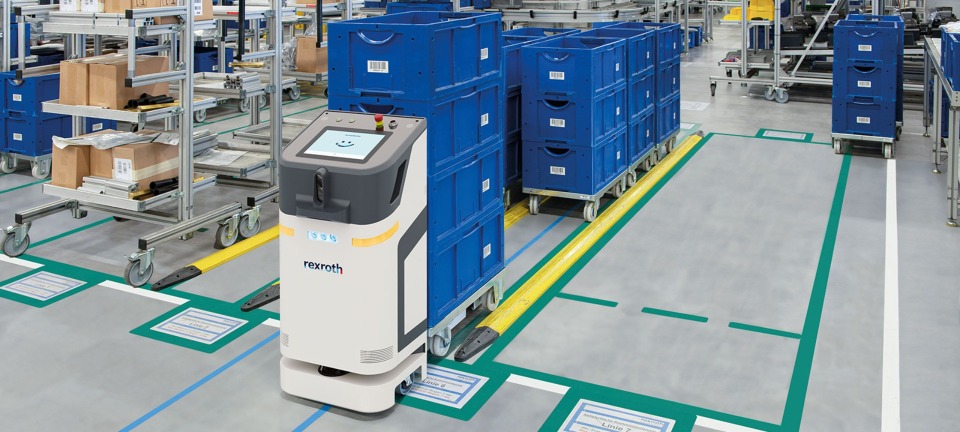 Bosch Rexroth ActiveShuttle intralogistics mobile robot picks up small load carriers.