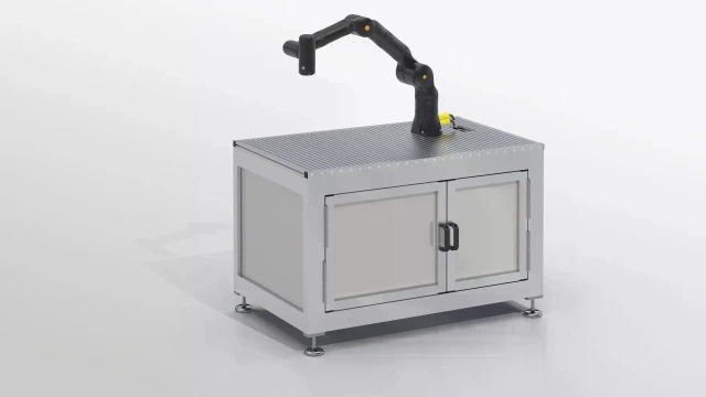 Rectangular table with cabinet elements. Metal table with mounted robotic arm