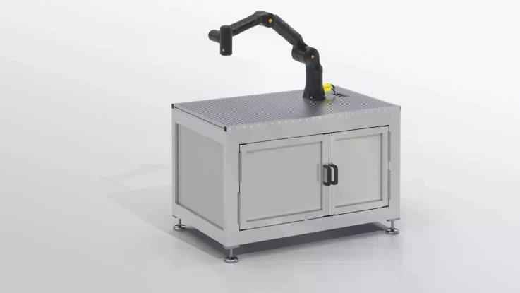 Rectangular table with cabinet elements. Metal table with mounted robotic arm.