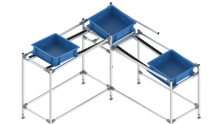 3 blue boxes that are guided around a 90-degree corner on roller conveyors. Descending sections with a special corner as a transfer unit.