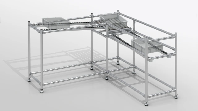 Modular Karakuri solution made of aluminum profiles with roller conveyor and transport containers for industrial material flow and automation systems