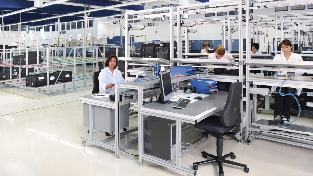 Woman sitting on Dynamic-ESD industrial swivel work chair