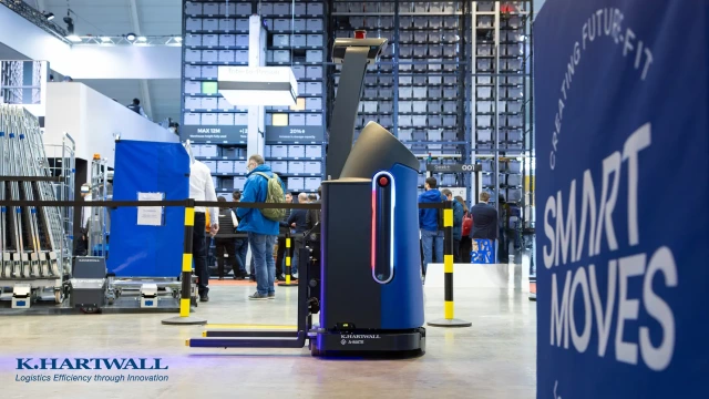 A-Mate AGVs by K.Hartwall driving in an exhibition hall 