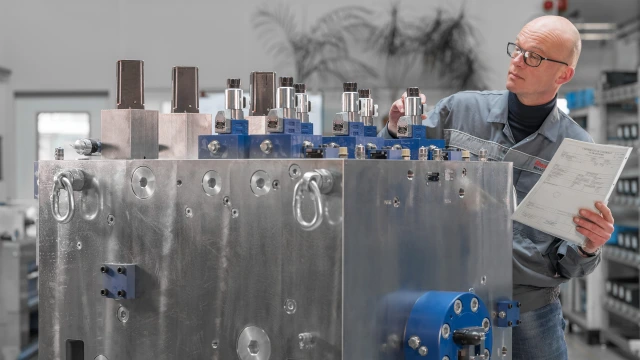 Employee testing a customized manifold