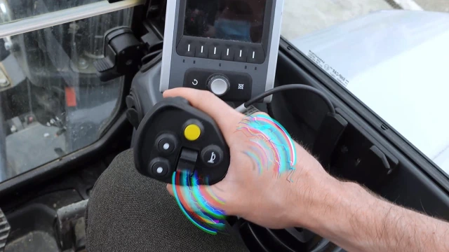 Joystick in the cabine of a wheeled loader giving haptical feedback