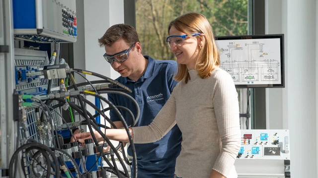 Employees at an exercise setup on the Hydraulix 300 training system.